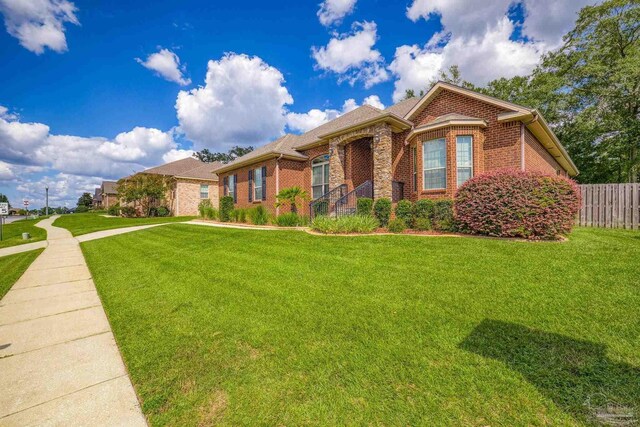 view of front of house featuring a front yard and a garage