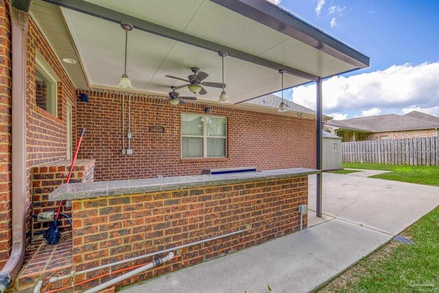 back of house with a patio and a yard