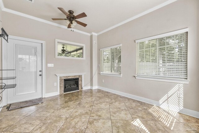 entryway with light tile patterned flooring, crown molding, and a high ceiling