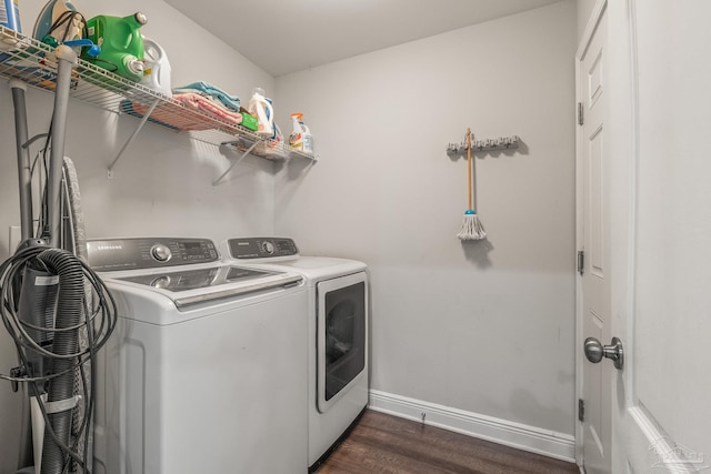 laundry area featuring dark hardwood / wood-style flooring and independent washer and dryer