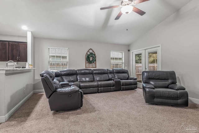 carpeted living room featuring french doors, ceiling fan, lofted ceiling, and a wealth of natural light