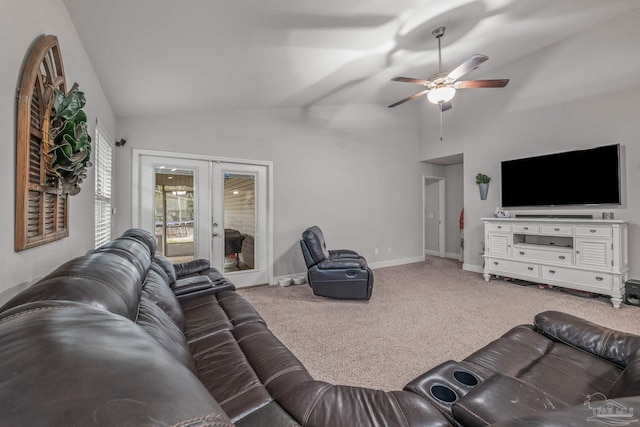 carpeted living room featuring lofted ceiling, ceiling fan, and french doors