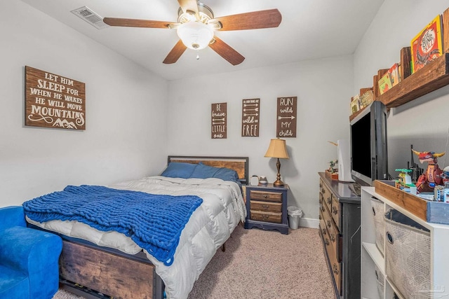 bedroom with light carpet and ceiling fan