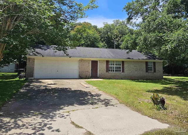 6027 Villeneuve Ln, Pensacola, FL 32526 - view of front of home with brick siding, concrete driveway, a garage, and a front lawn