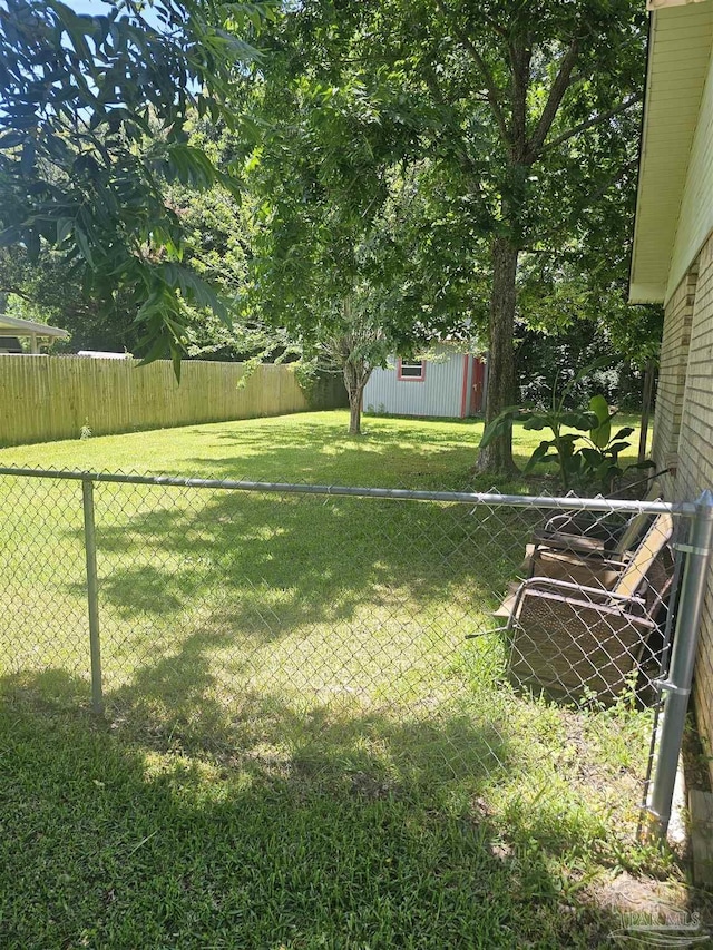 6027 Villeneuve Ln, Pensacola, FL 32526 - fenced backyard with an outbuilding