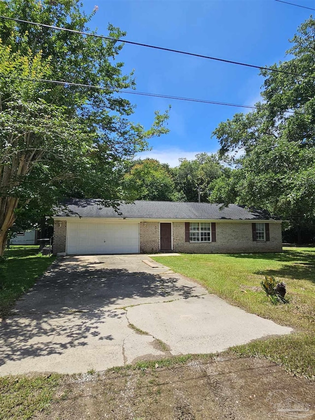 6027 Villeneuve Ln, Pensacola, FL 32526 - view of front of home with driveway, an attached garage, a front yard, and brick siding