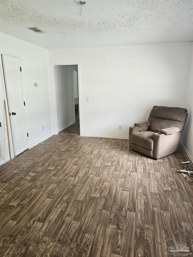 6027 Villeneuve Ln, Pensacola, FL 32526 - unfurnished room featuring wood finished floors and a textured ceiling