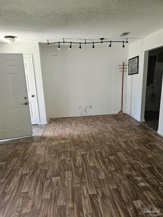 6027 Villeneuve Ln, Pensacola, FL 32526 - spare room with wood finished floors, track lighting, and a textured ceiling
