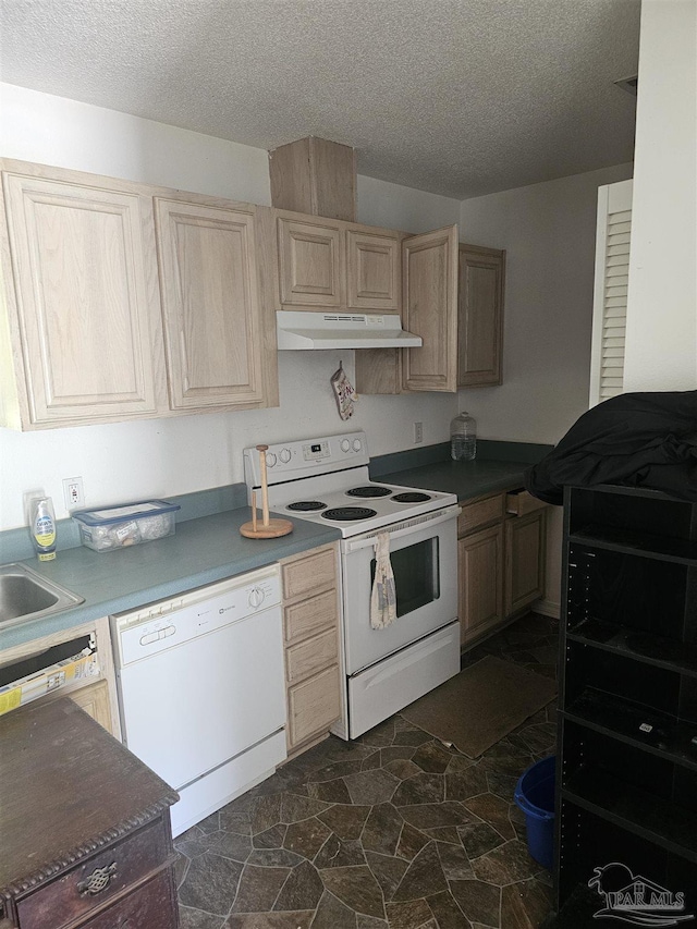 6027 Villeneuve Ln, Pensacola, FL 32526 - kitchen with white appliances, under cabinet range hood, light brown cabinetry, a textured ceiling, and dark stone finish flooring