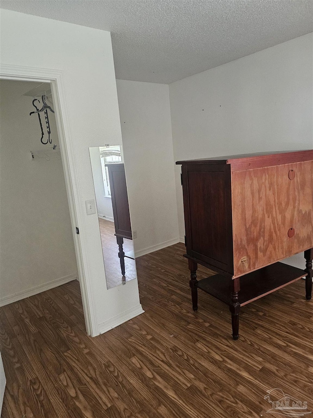 6027 Villeneuve Ln, Pensacola, FL 32526 - bedroom with dark wood-style floors and a textured ceiling