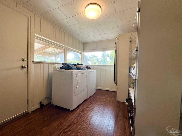 6414 Hamilton Bridge Rd, Milton, FL 32570 - washroom featuring separate washer and dryer, dark wood-type flooring, and wood walls