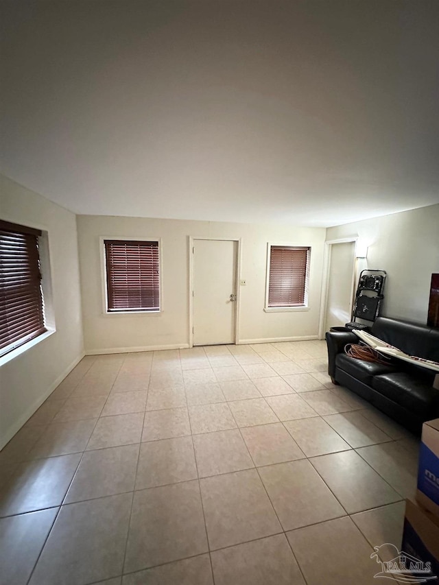 6414 Hamilton Bridge Rd, Milton, FL 32570 - tiled living room with baseboards