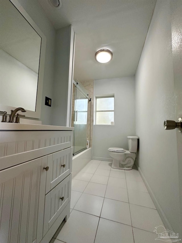 6414 Hamilton Bridge Rd, Milton, FL 32570 - full bathroom featuring toilet, bath / shower combo with glass door, tile patterned flooring, and vanity