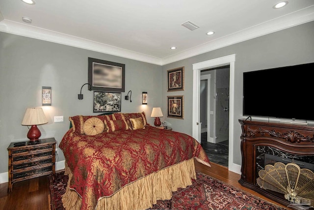 bedroom featuring dark wood-type flooring and crown molding