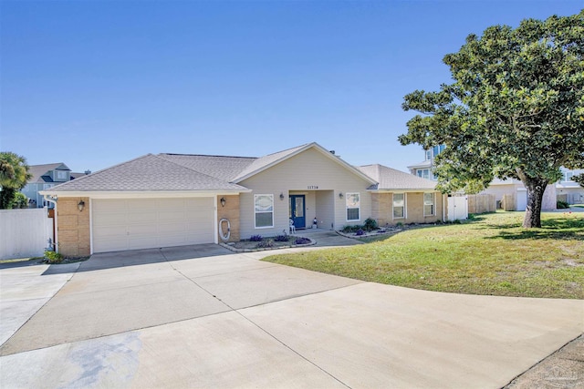 single story home featuring a garage, a front yard, concrete driveway, and fence