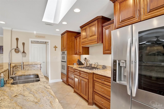 kitchen with light tile patterned floors, a sink, visible vents, appliances with stainless steel finishes, and crown molding