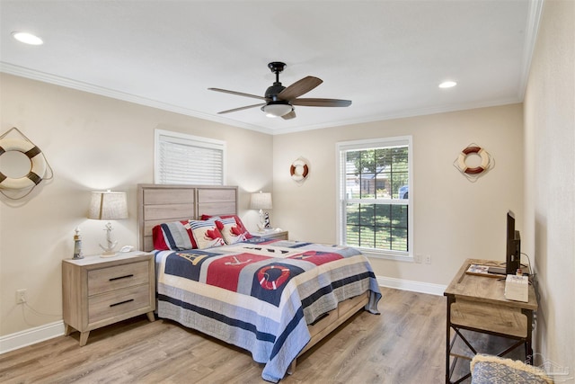 bedroom with baseboards, light wood finished floors, a ceiling fan, and crown molding