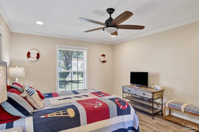 bedroom with recessed lighting, ornamental molding, a ceiling fan, wood finished floors, and baseboards