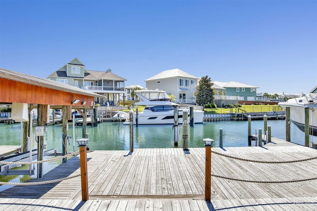 dock area featuring a residential view, a water view, and boat lift