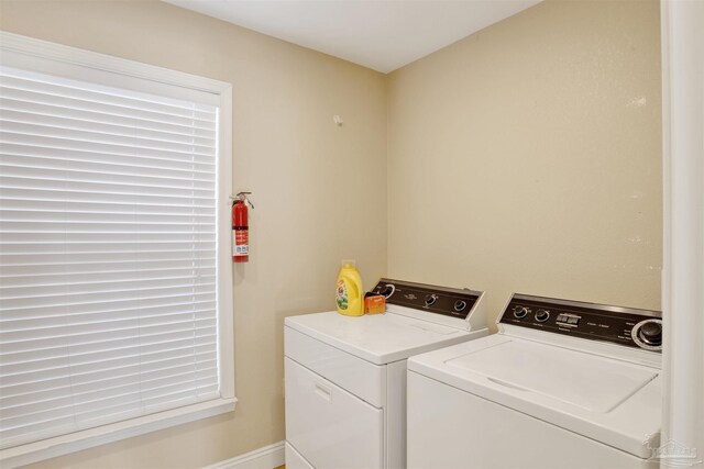 washroom with laundry area and separate washer and dryer