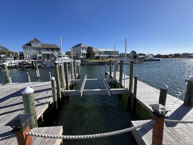 view of dock featuring a water view and boat lift