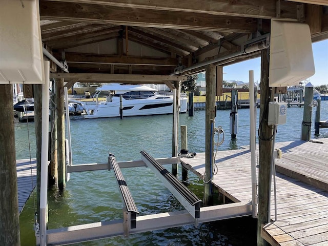 view of dock featuring a water view and boat lift