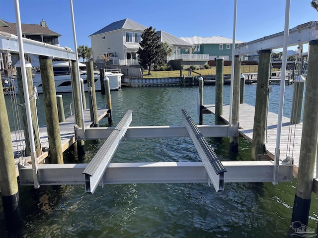 view of dock featuring a water view and boat lift