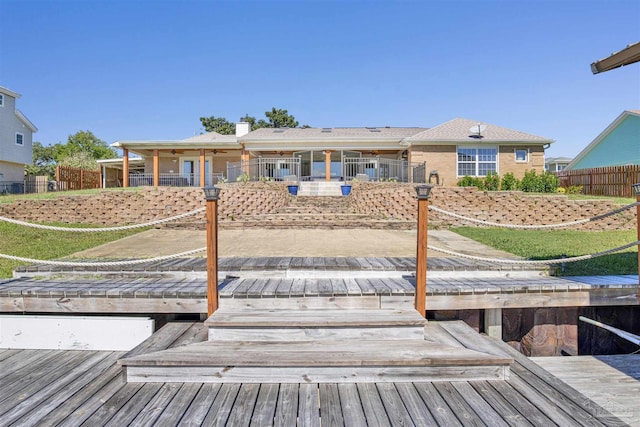 rear view of house with fence