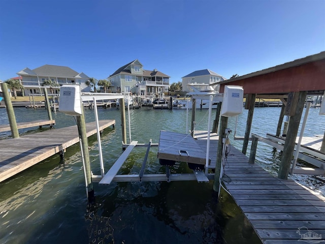 dock area featuring a water view and boat lift