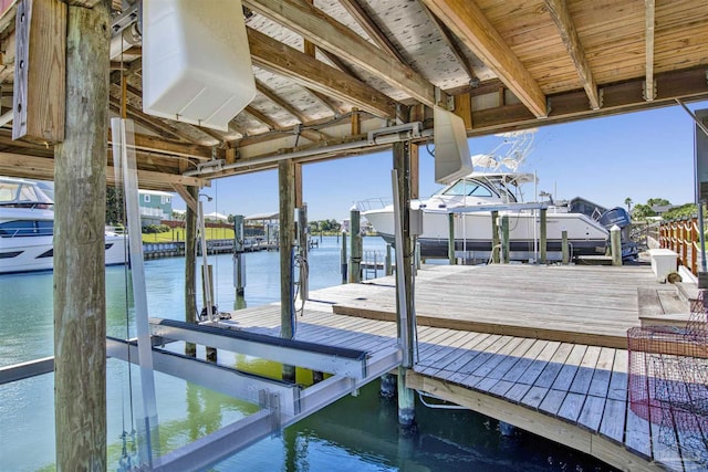 dock area featuring a water view and boat lift