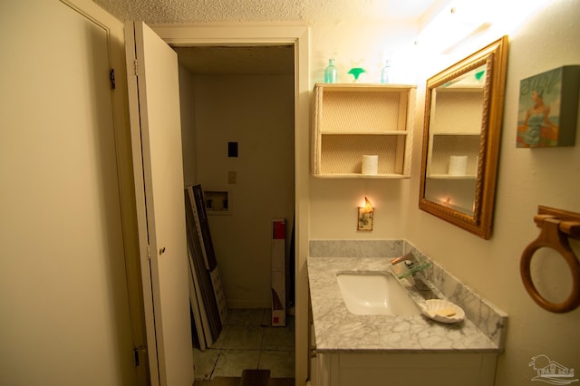 bathroom featuring tile patterned flooring and vanity