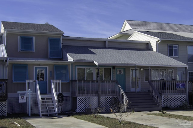 townhome / multi-family property featuring a porch