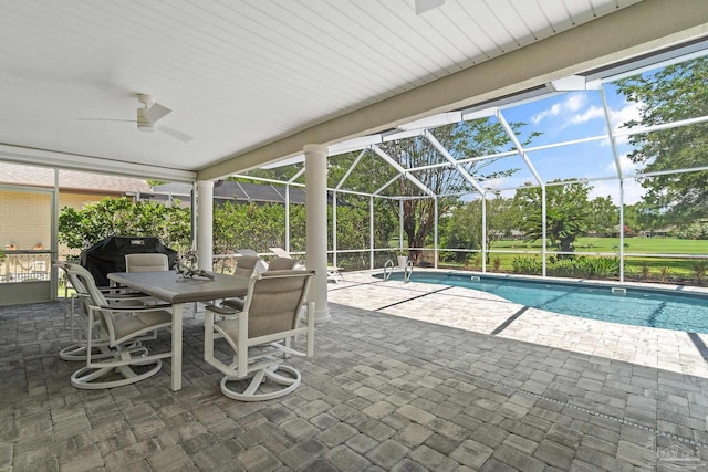 view of pool featuring a patio, ceiling fan, a lanai, and grilling area