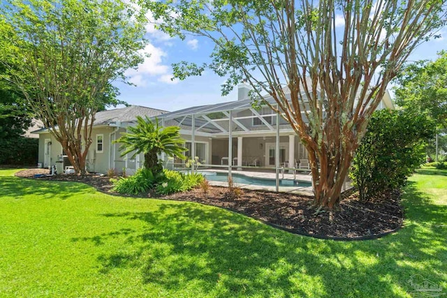 exterior space with a yard and a lanai