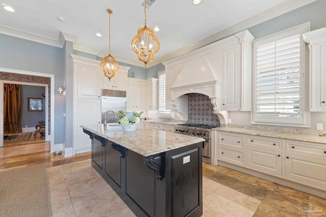 3410 N 18th Ave, Pensacola, FL 32503 - kitchen featuring custom range hood, an inviting chandelier, an island with sink, white cabinetry, and high end appliances