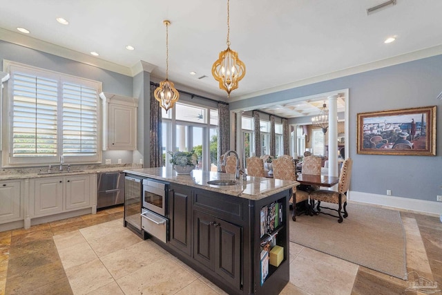 3410 N 18th Ave, Pensacola, FL 32503 - kitchen featuring a sink, visible vents, stainless steel microwave, and a chandelier