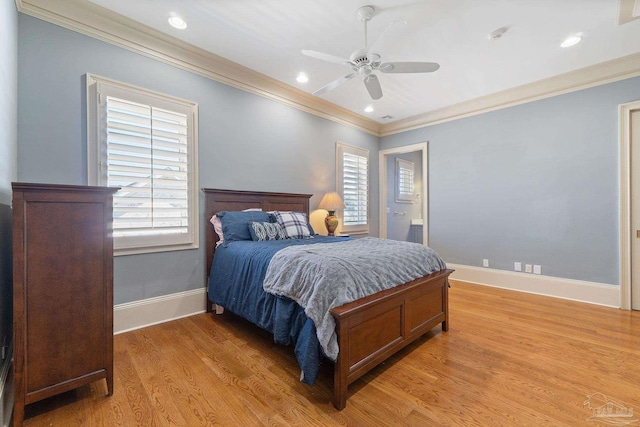 bedroom with light wood-type flooring, ceiling fan, and ornamental molding