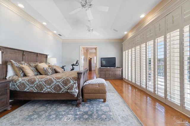 bedroom featuring wood-type flooring, ornamental molding, access to exterior, and ceiling fan