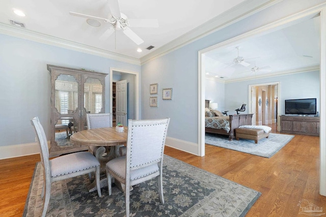 3410 N 18th Ave, Pensacola, FL 32503 - dining area with wood finished floors, ceiling fan, ornamental molding, and visible vents