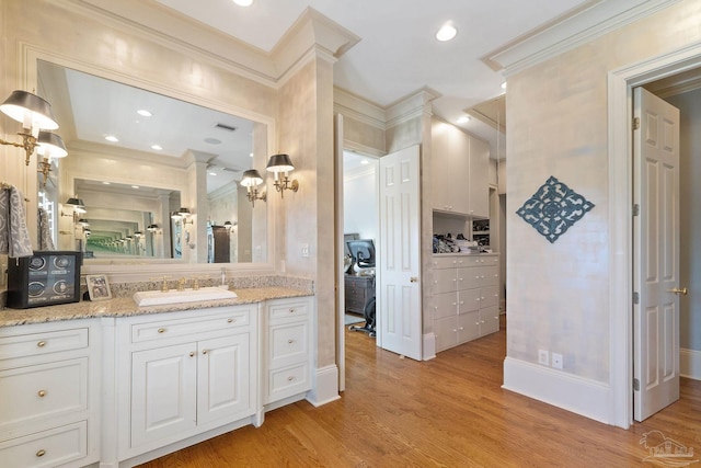 3410 N 18th Ave, Pensacola, FL 32503 - bathroom featuring crown molding, visible vents, vanity, and wood finished floors