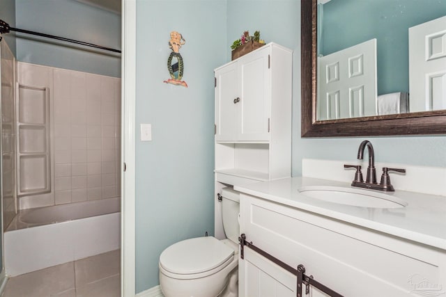 full bathroom with tile patterned floors, toilet, vanity, and tiled shower / bath combo