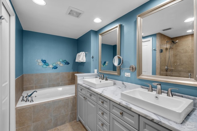 bathroom with separate shower and tub, tile patterned flooring, and vanity