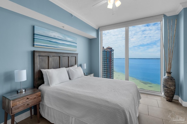 bedroom featuring ceiling fan, light tile patterned flooring, a water view, and crown molding