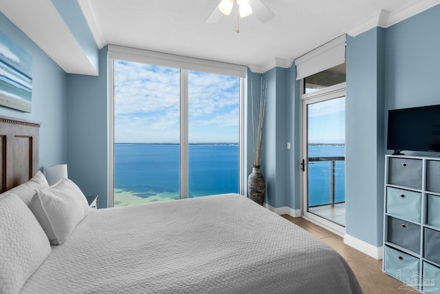 tiled bedroom featuring access to outside, ceiling fan, and crown molding