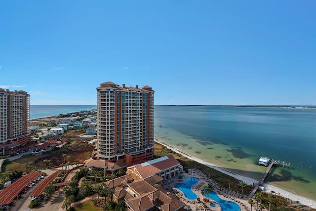 bird's eye view with a water view and a beach view