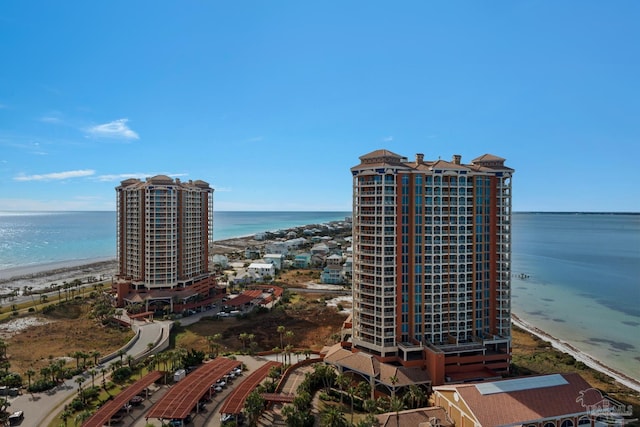 drone / aerial view featuring a view of the beach and a water view