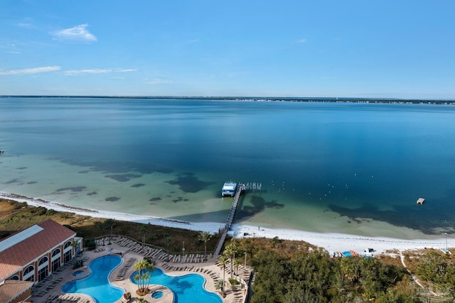 bird's eye view featuring a water view and a view of the beach