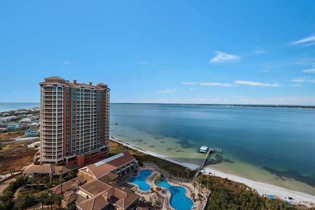 aerial view with a water view and a view of the beach