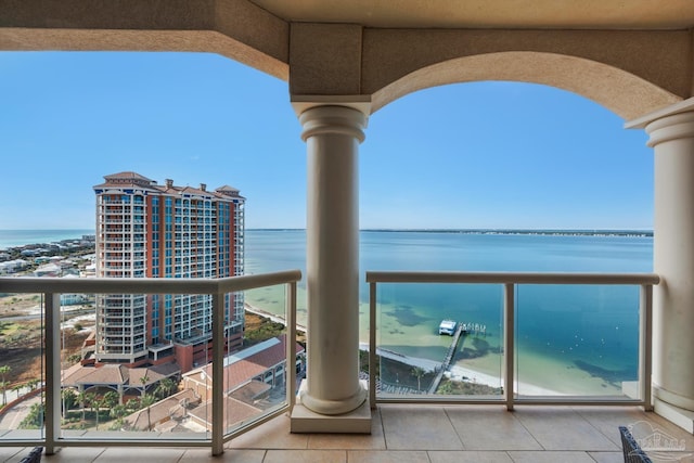 balcony featuring a water view