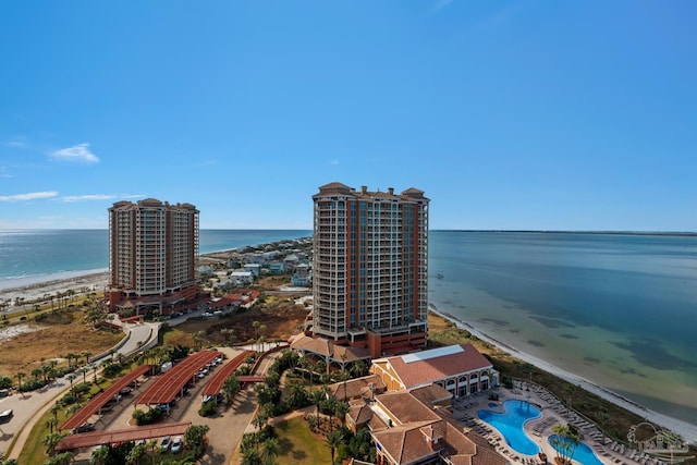 drone / aerial view featuring a water view and a beach view